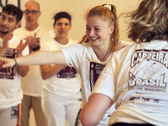 The roda clapping, Capoeira Brasil and Game Experience shirts